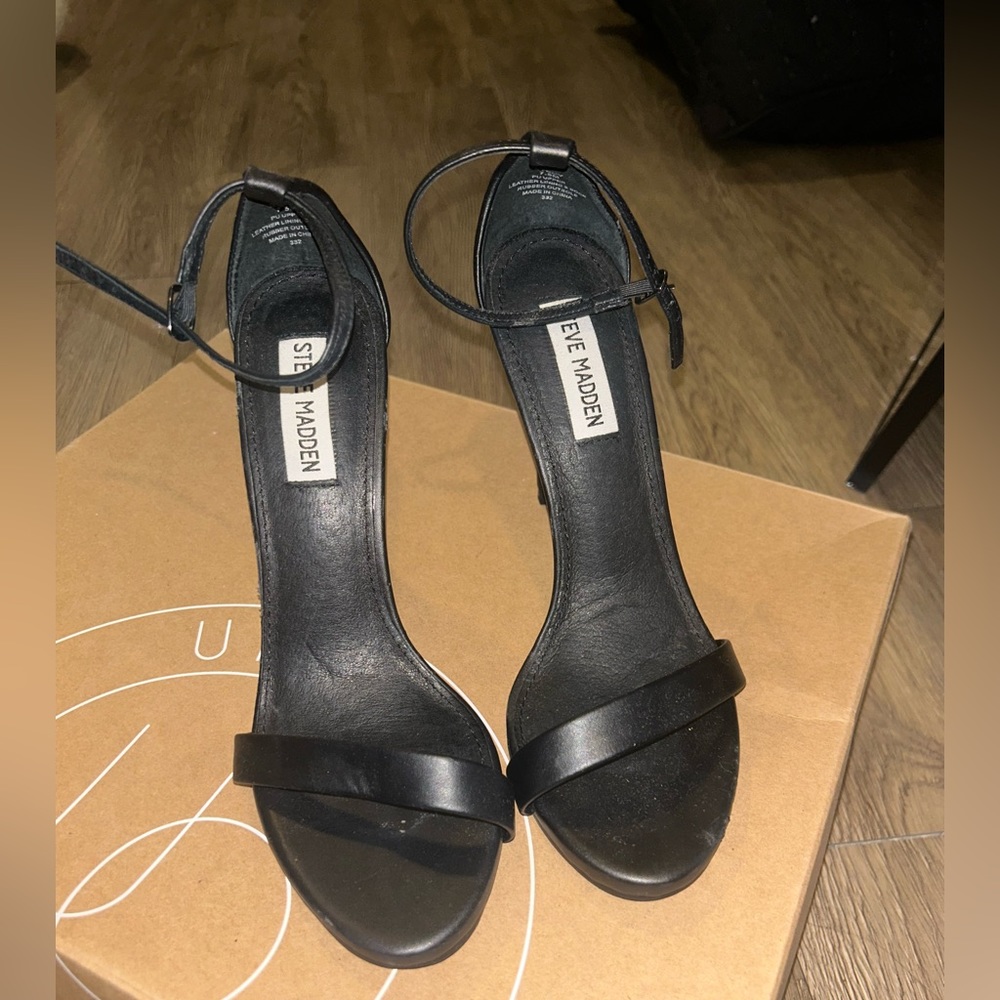 Black Steve Madden heels that strap around the ankle